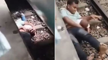 Baba trenin altında kalan çocuğunu kurtardı