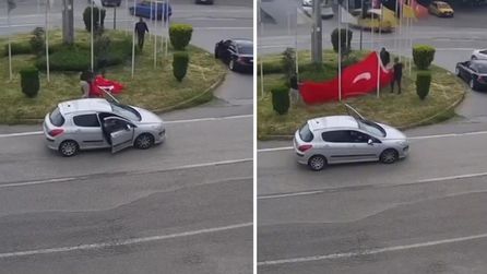 Dörtyol'da rüzgar nedeniyle düşen Türk bayrağı vatandaşlarca toplandı